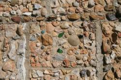  Stones that Mrs. Quigley began collecting as a girl assumed and important part of the house. Working tenderly for three years, Mrs. Quigley covered the outside walls with a collection of fossils, crystals, arrowheads and stones selected from the creak beds for their beauty. A perennial garden surrounds the house.

The inside of the house is a collection of family antiques and mementoes that express Mrs. quigleys love of nature. especially spectacular is the Butterfly Wall that is beyond imagination

This was her home and passion for another 50 years as she continued to collect and surround herself with the nature she loved. My grandfather and she were very compatible; he took her everywhere she went to collect, as she couldnt drive. He continued to make a living with the farm and lumber mill until he passed away in 1972, at the age of 66. Elise Quigley died at the age of 74 in 1984. 
